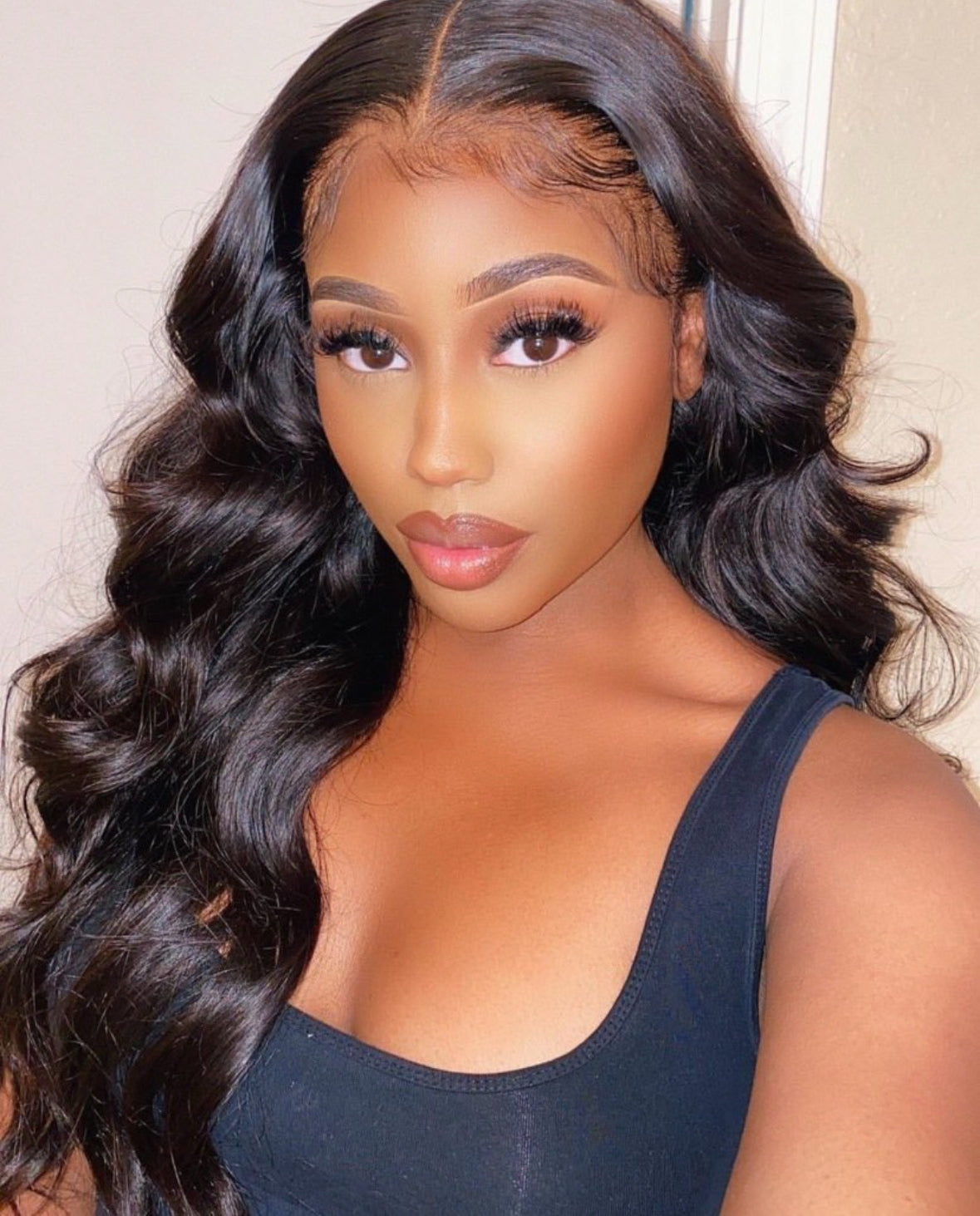 model wearing body wave virgin hair extensions and frontal